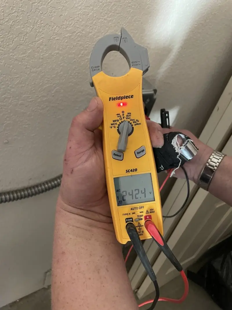 Voltage testing with clamp meter during Ceiling Fan Installation in South Riding